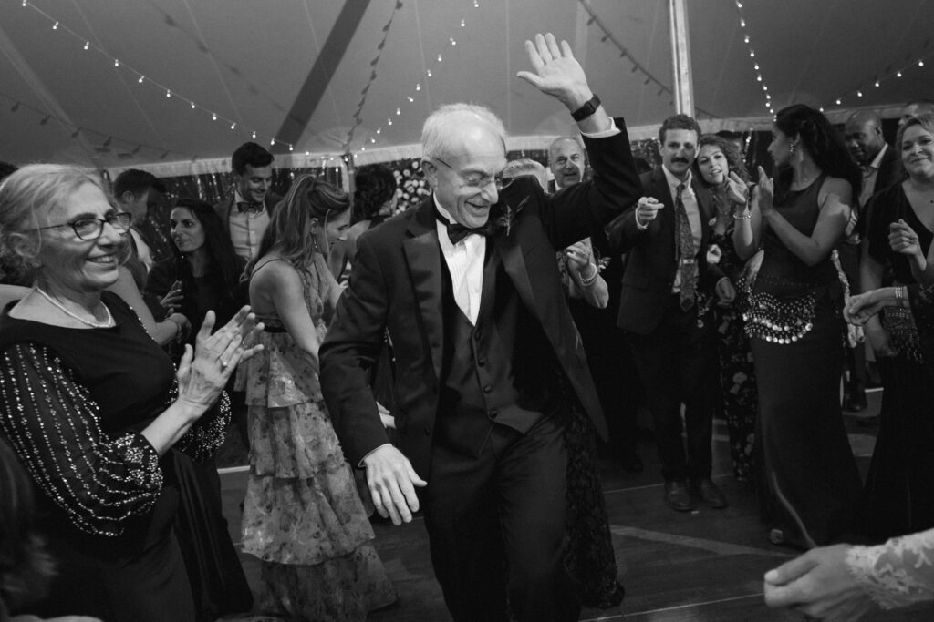 Man in black tuxedo dancing