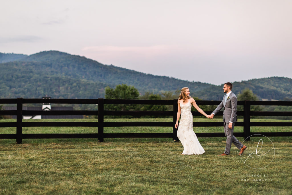 Couple walking in front of mountains at Montfair Resort Farm