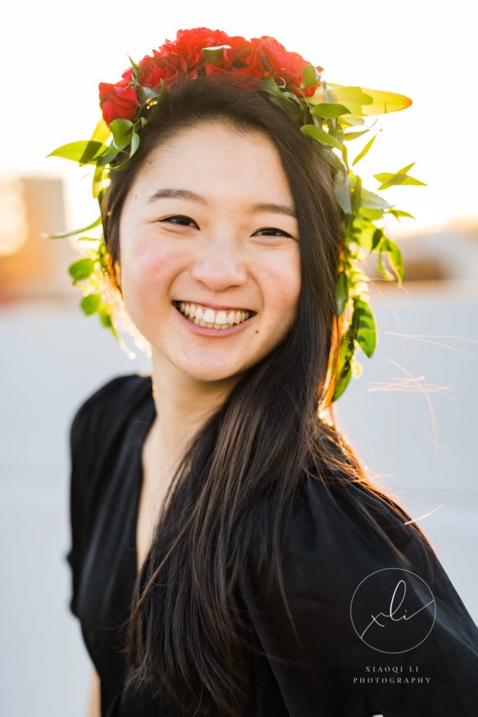 Xiaoqi of Xiaoqi Li Photography wearing floral crown and celebrating International Women's Day