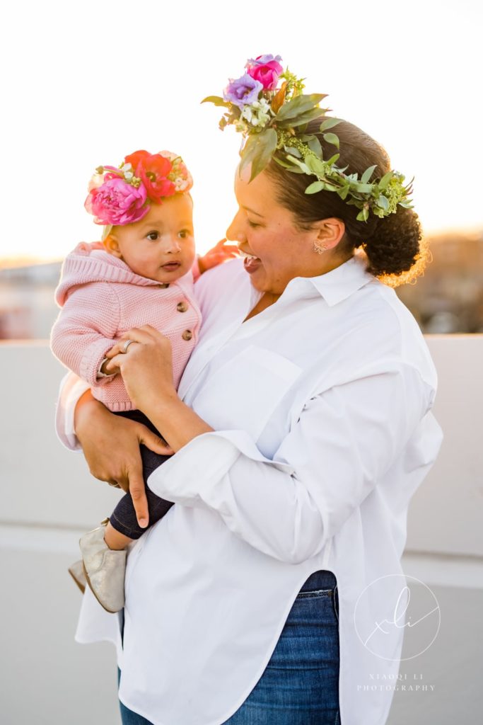 Mother and daughter celebrating international women's day wearing floral crowns