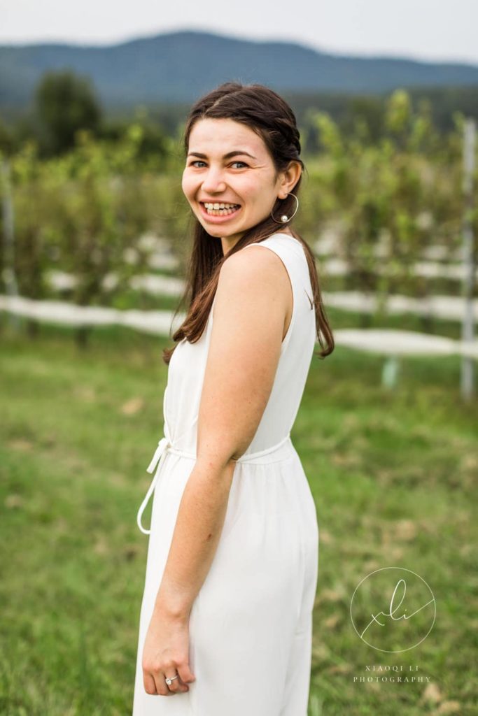 woman smiling at stinson vineyard