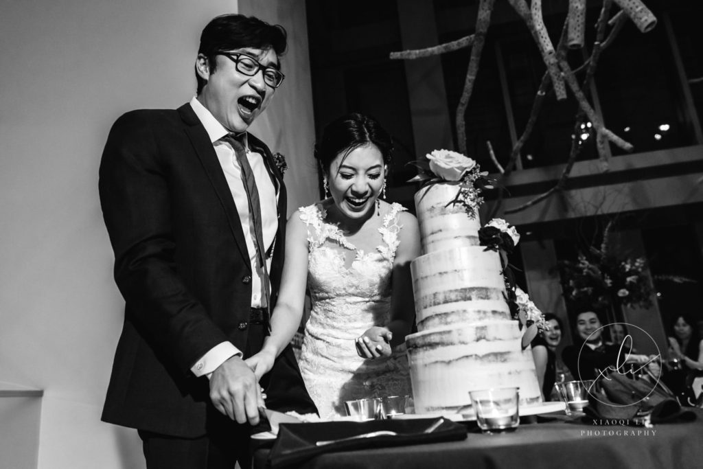Couple cutting cake at Seattle Museum of Art Wedding Reception