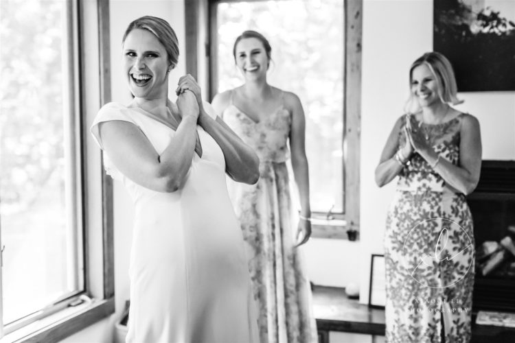 Woman showing her wedding dress to bridesmaids