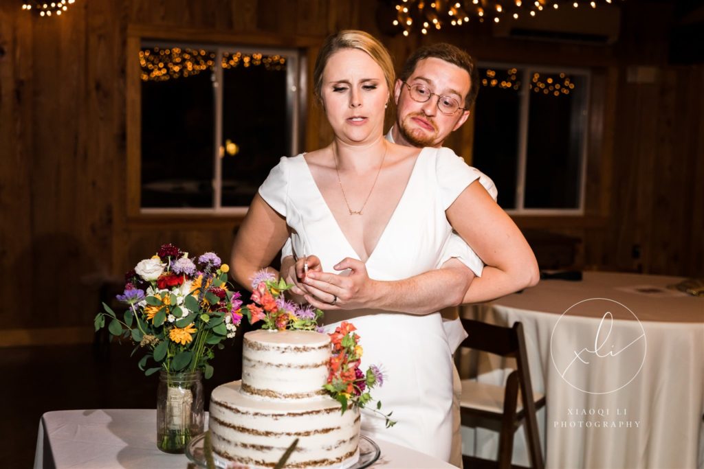 Couple cutting wedding cake together after episcopal wedding