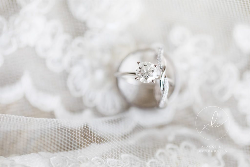 detail shot of wedding rings on wedding veil before tea ceremony