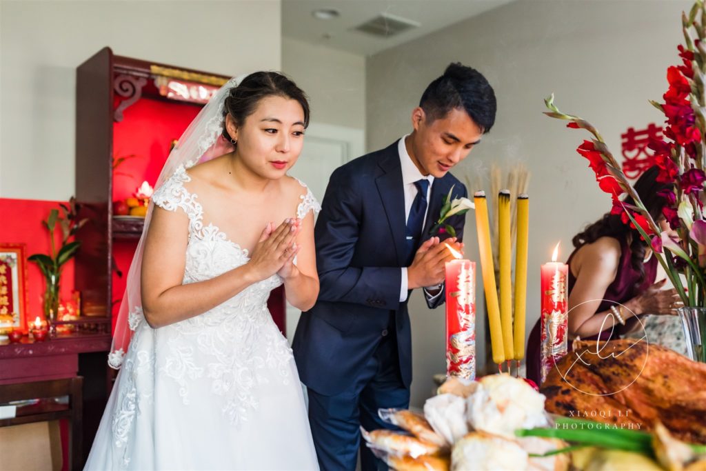 Couple bowing during traditional Chinese tea ceremony