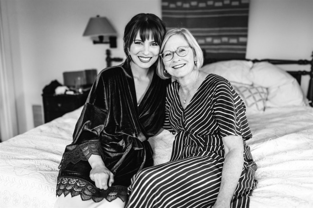 woman smiling on bed with mother in Charlottesville 