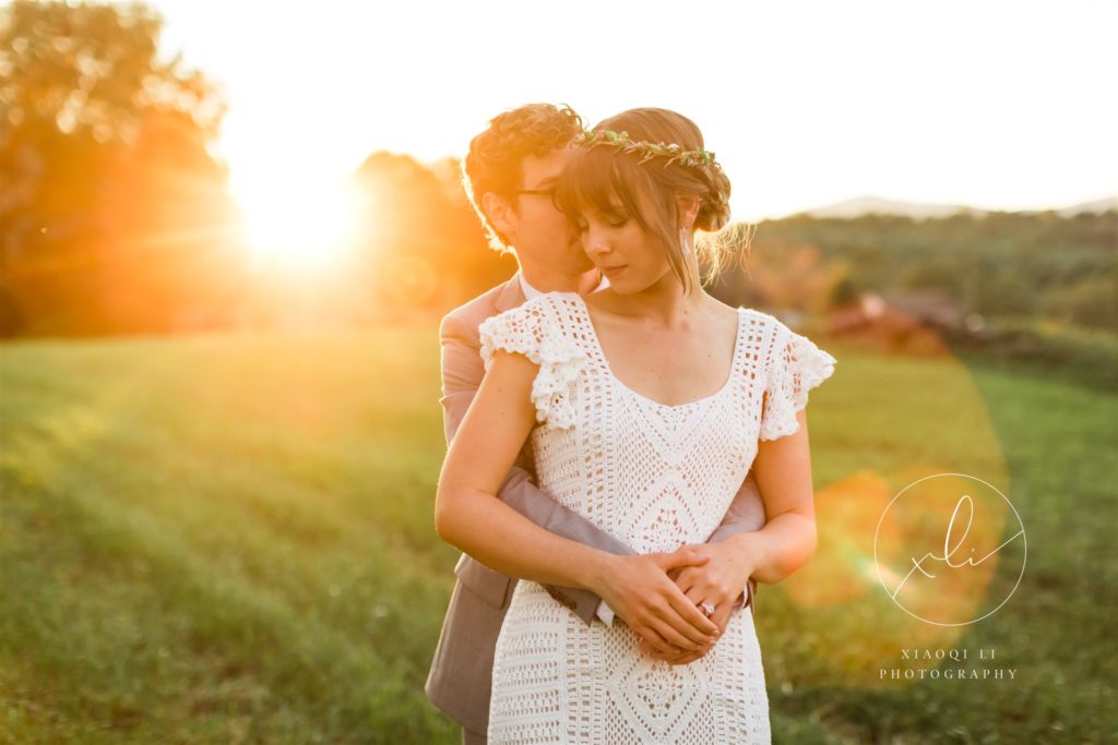 couple hugging during golden hour after fall backyard wedding