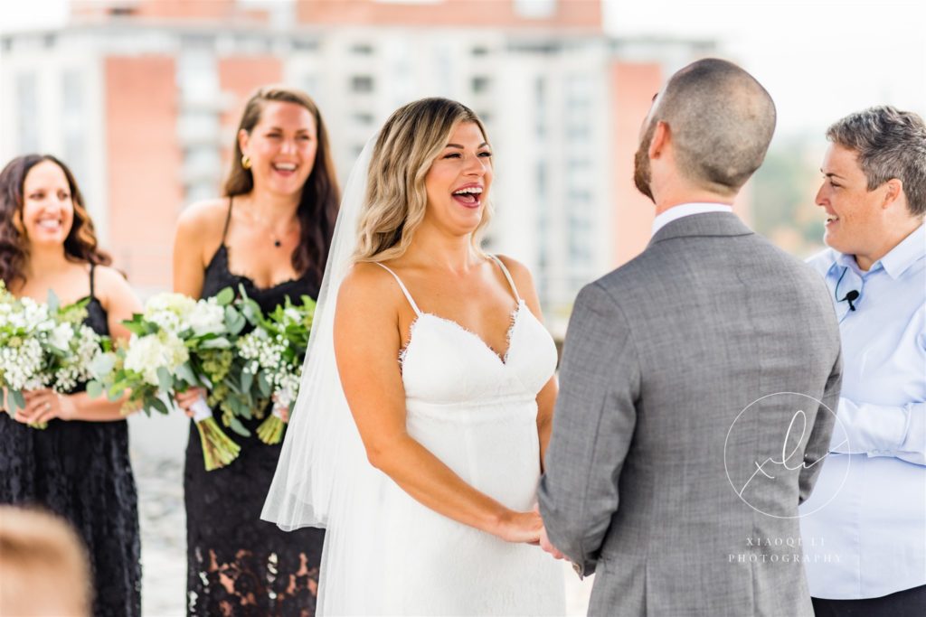 bride laughing during wedding ceremony at quirk hotel in RIchmond