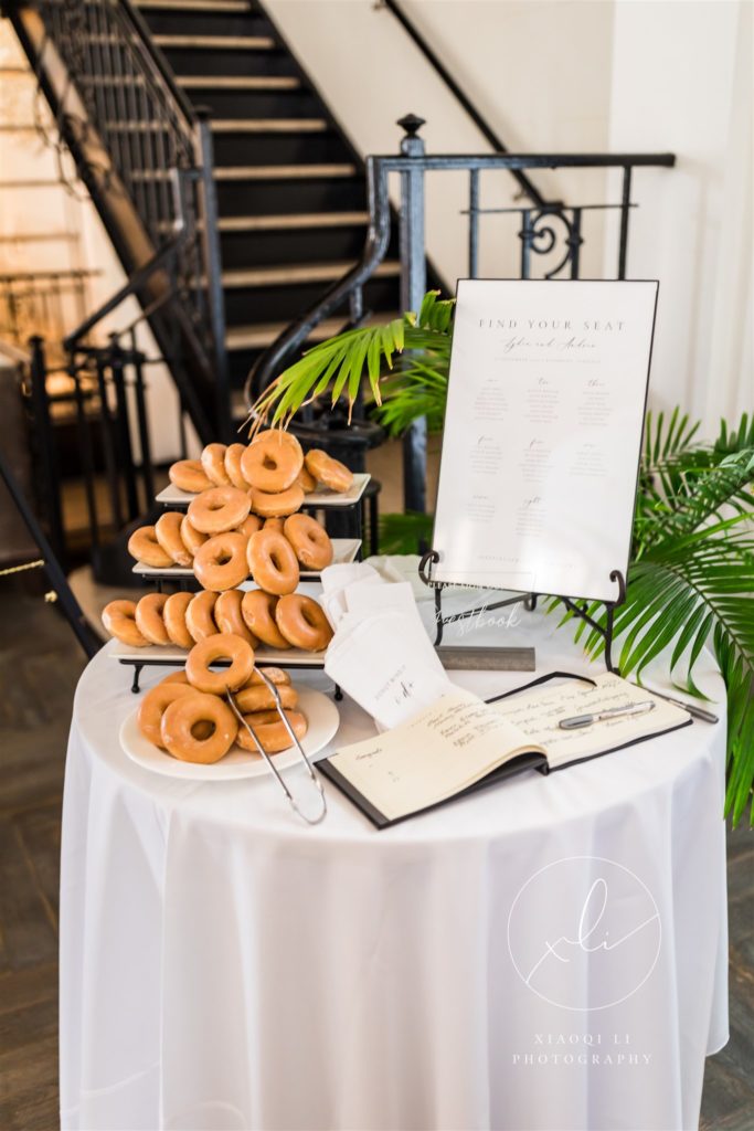 wedding breakfast details with doughnuts and guest book to be signed