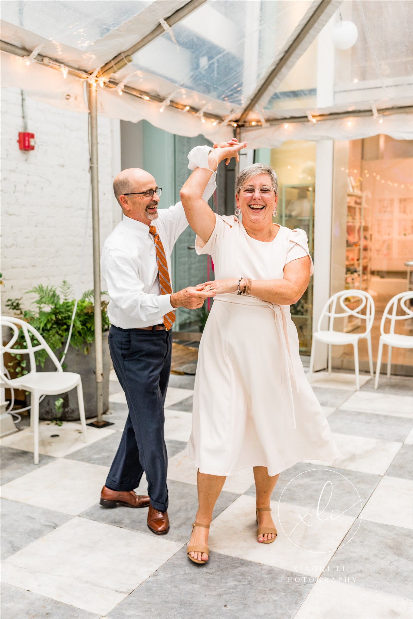 Couple dancing at Quirk Hotel during brunch reception