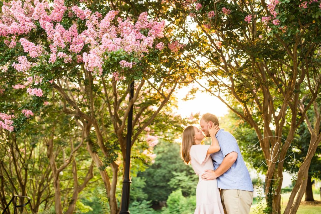 couple kissing during spring outdoor photography session in Libby Hill