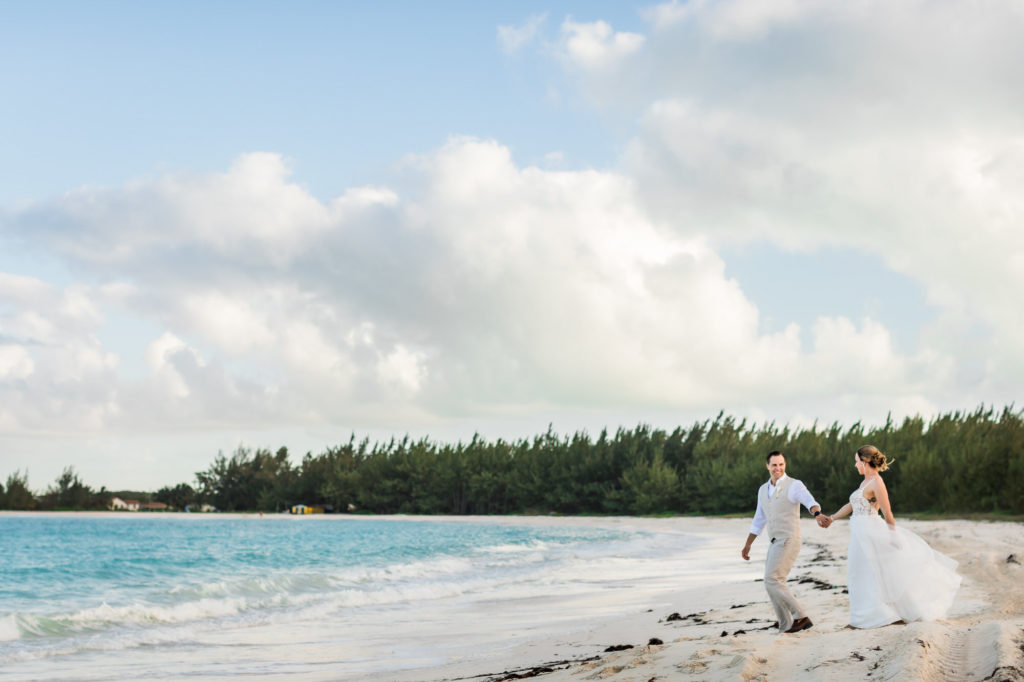 Newly married couple walking together after micro wedding in Bahamas