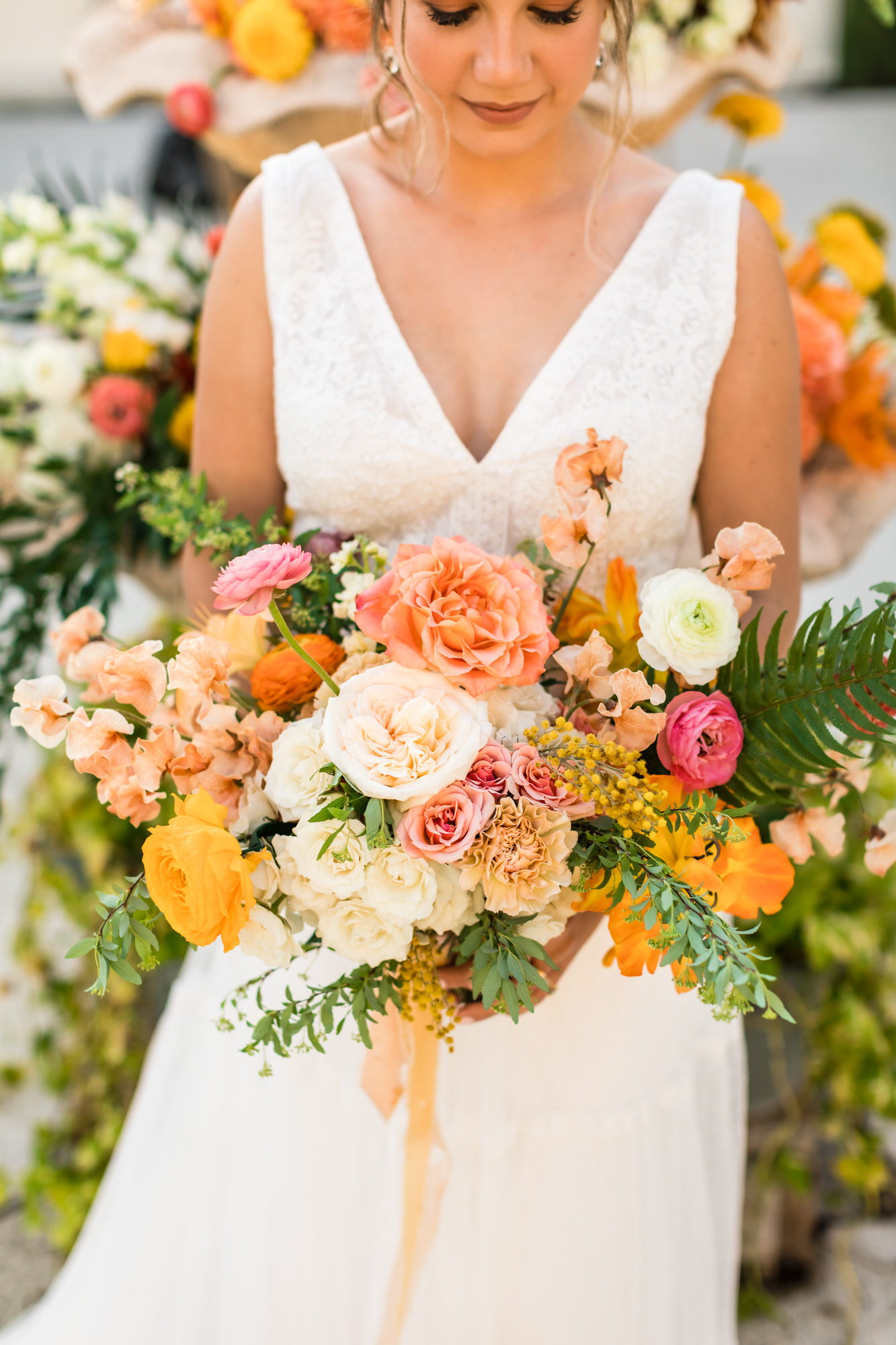 bridal bouquet with pink, orange, white, and green floral accents in Cuban inspired wedding
