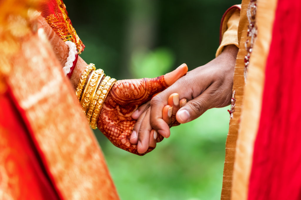 engaged couple holding hands before wedding ceremony