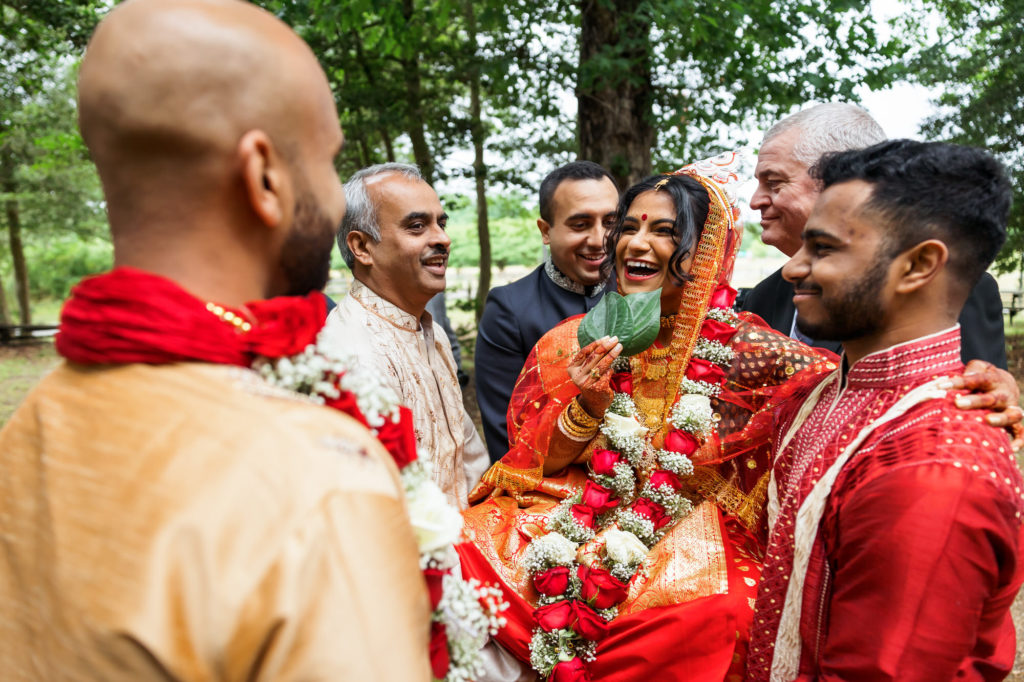 bride and groom staring at one another at alter during their hindu muslim interfaith wedding