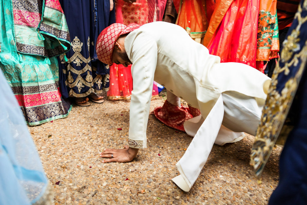 groom doing push ups after wedding ceremony