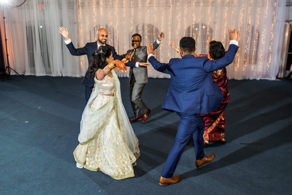 bridal party dancing at wedding reception