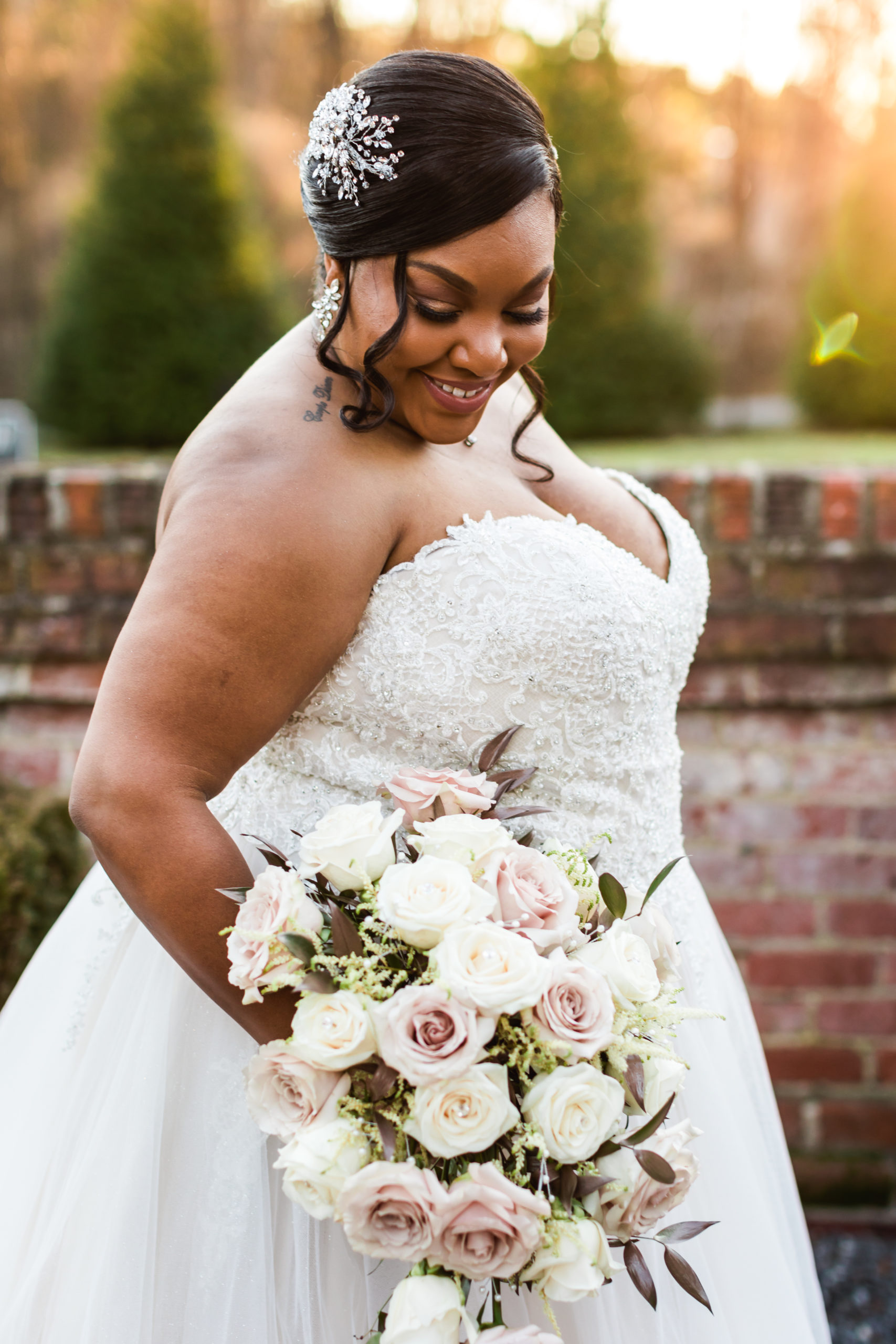 bride holding white and pink floral bouquet during bridal portraits in Richmond Virginia