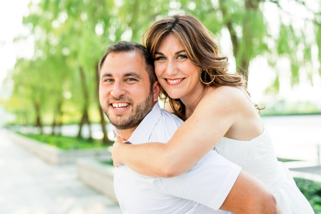 woman on man's back during outdoor engagement session