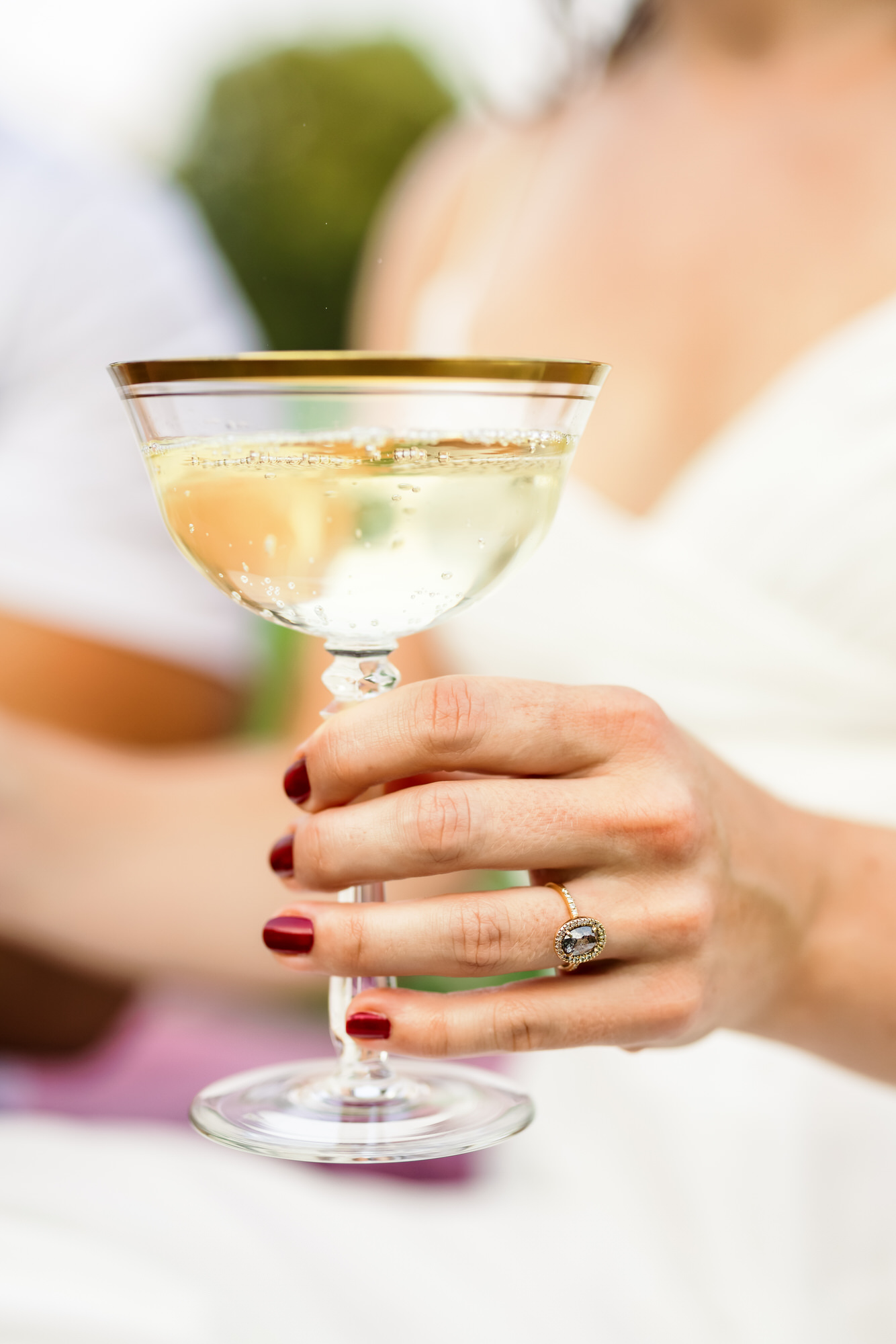 woman holding glass of champagne during kennedy center engagement session