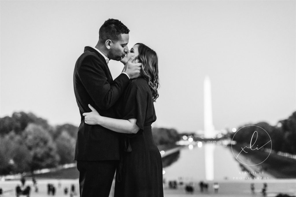 engaged couple hugging and kissing at Lincoln memorial in Washington DC