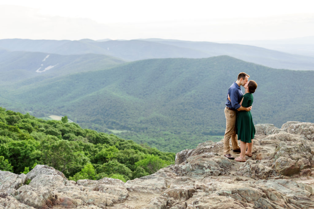 man and woman hugging and kissing during ravens roost engagement session