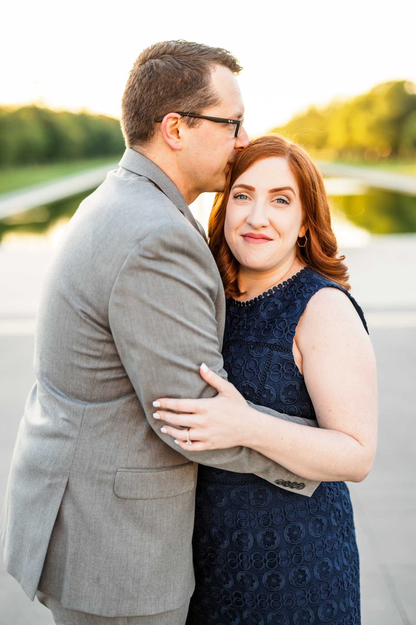 engaged couple hugging and smiling during lincoln memorial engagement session