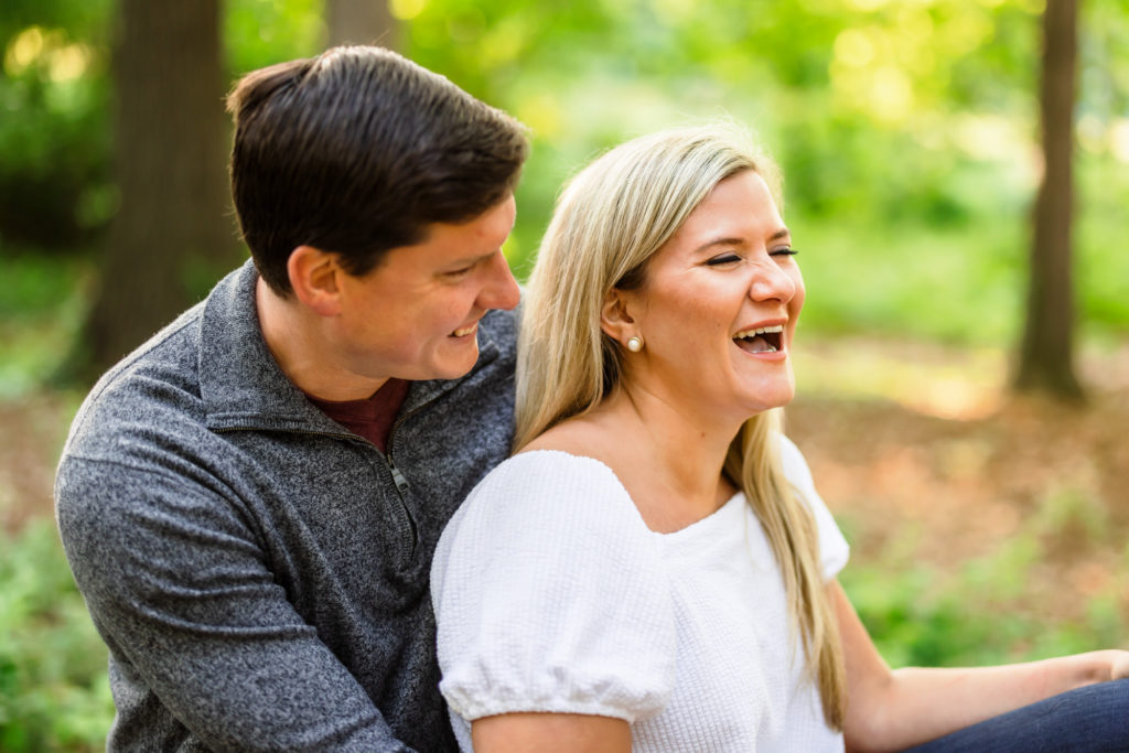engaged couple laughing together during Fort Slocum engagement session