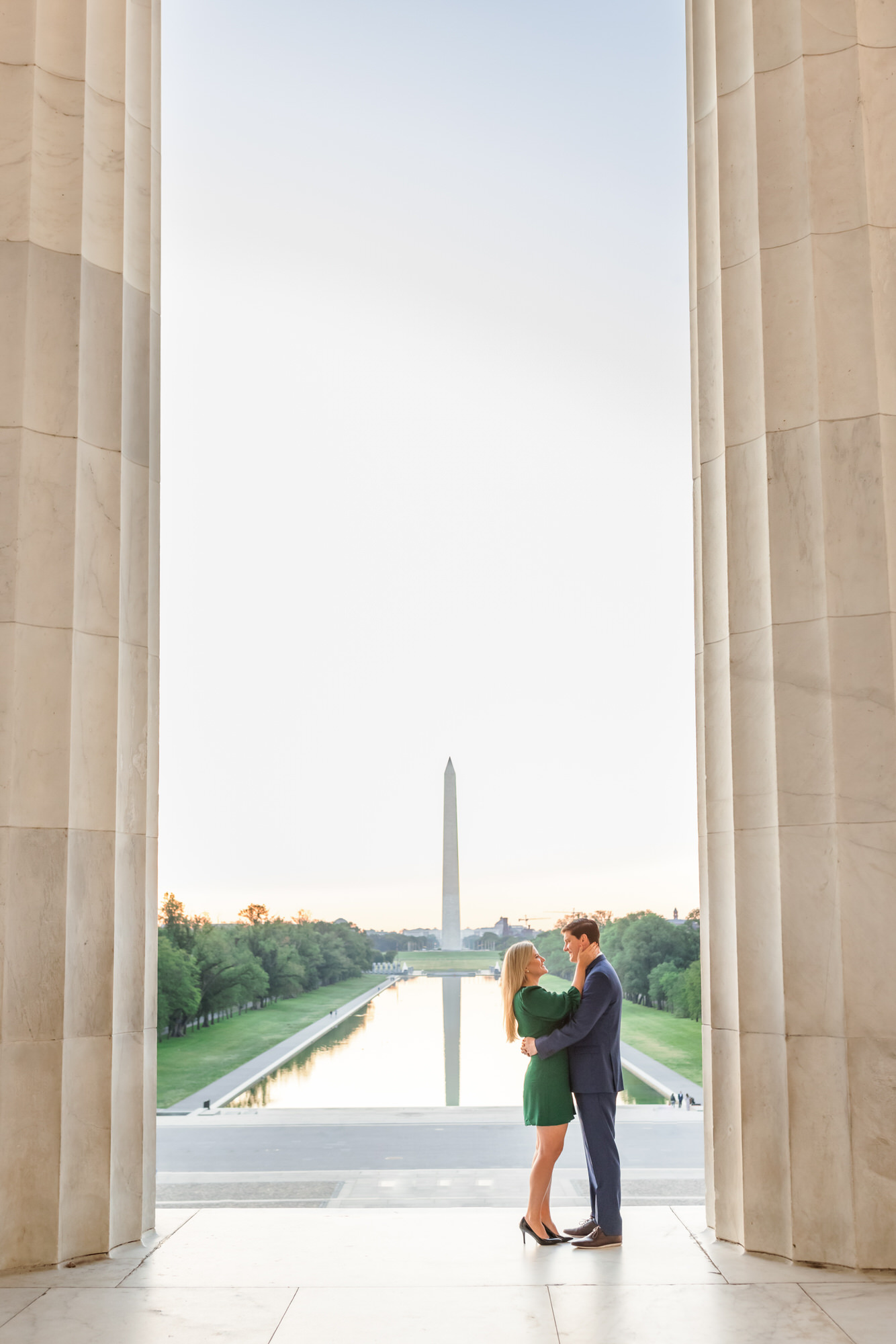 couple hugging at Lincoln Memorial during outdoor engagement session