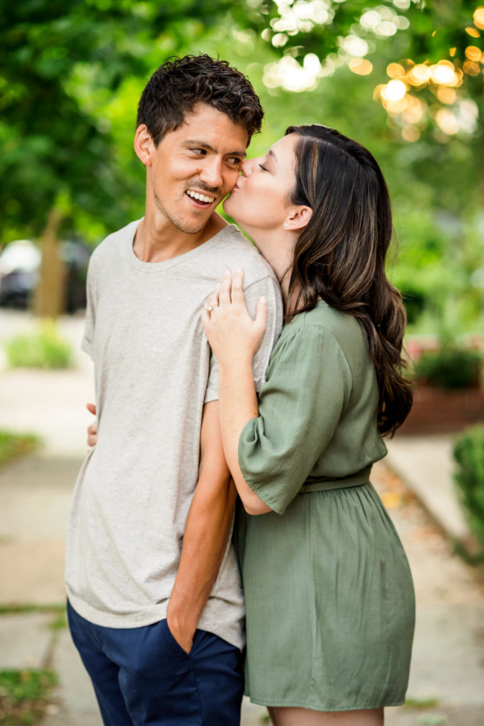 woman kissing man's cheek during scuffletown park engagement session