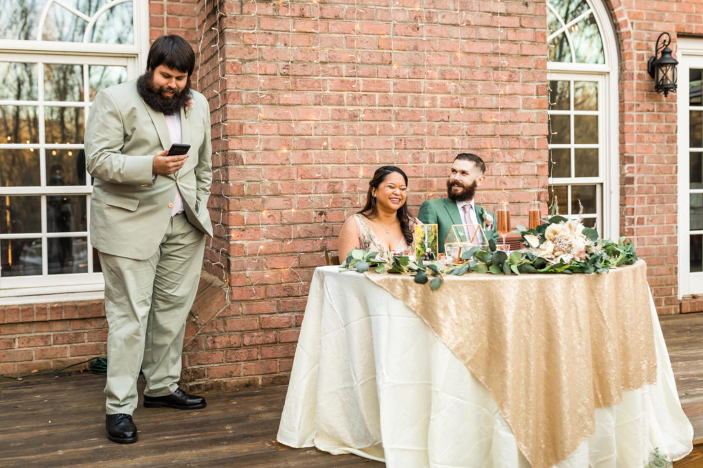 groomsman giving toast at wedding reception at airbnb wedding