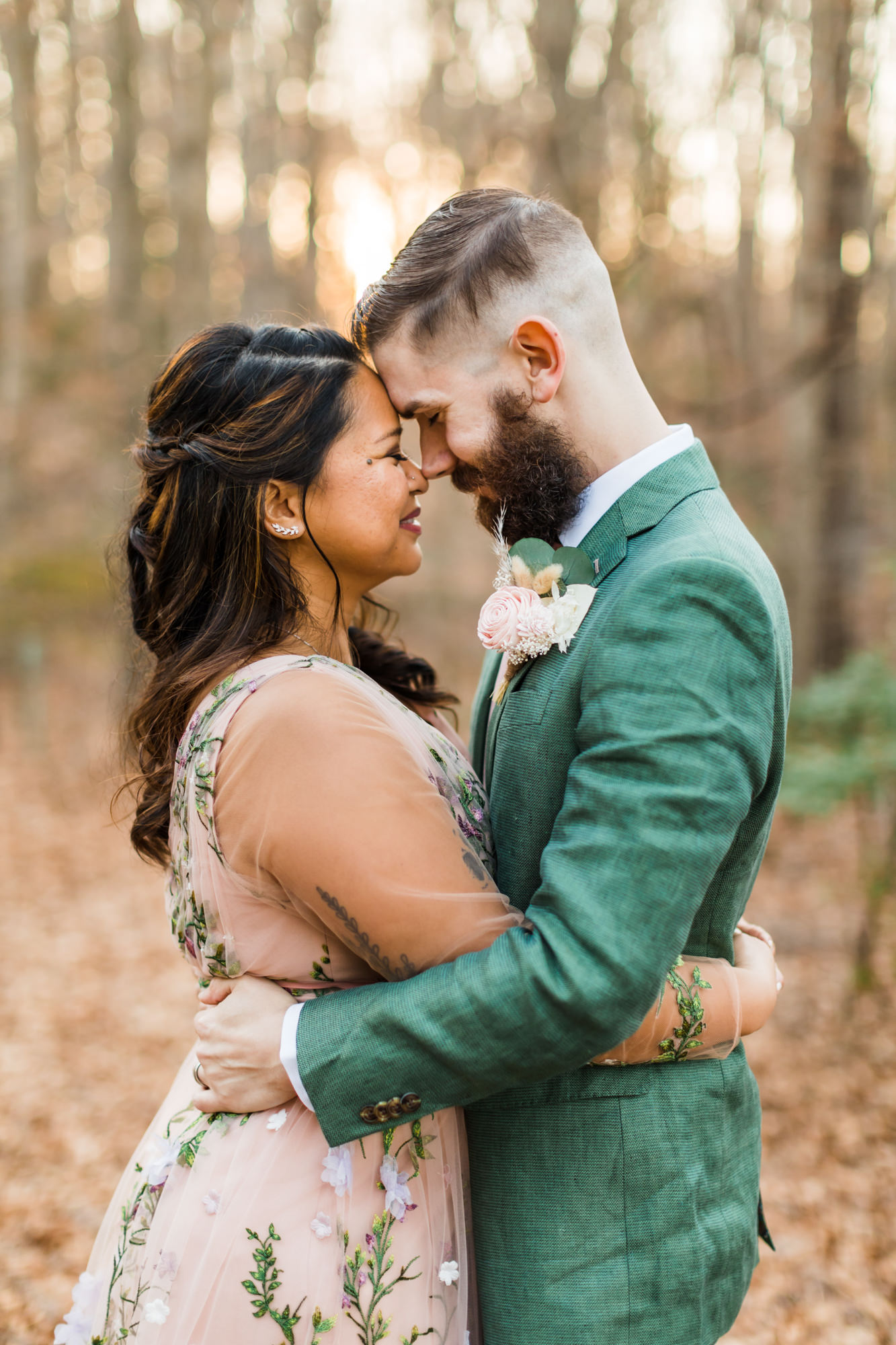 bridal couple hugging foreheads touching during bridal portraits