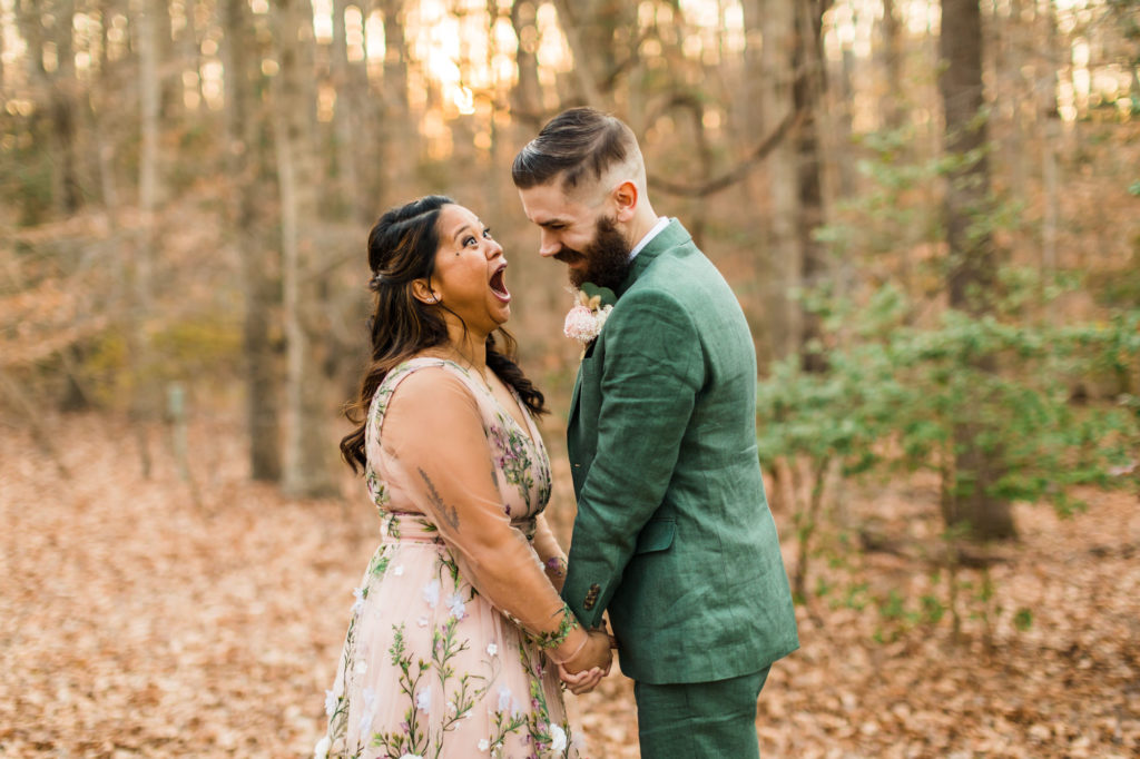 bride laughing and smiling at groom during outdoor portraits