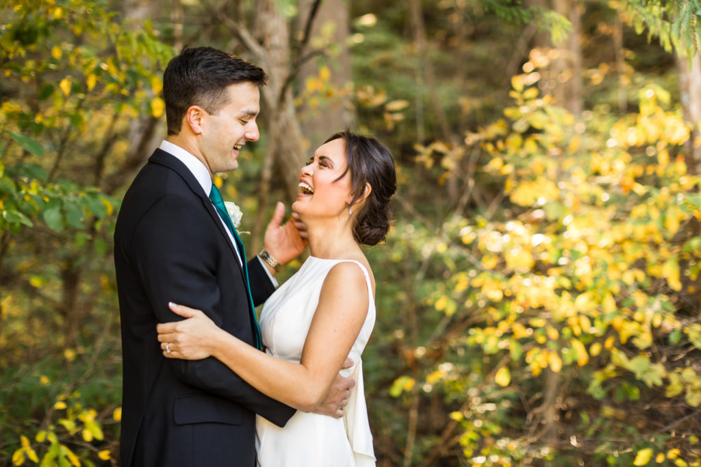 bride and groom dancing together during bridal portraits after first look during fall wedding