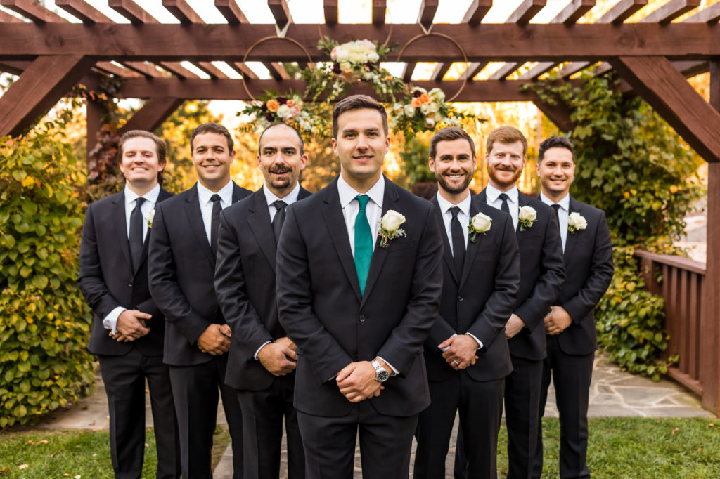 groom standing with groomsmen on house mountain inn wedding