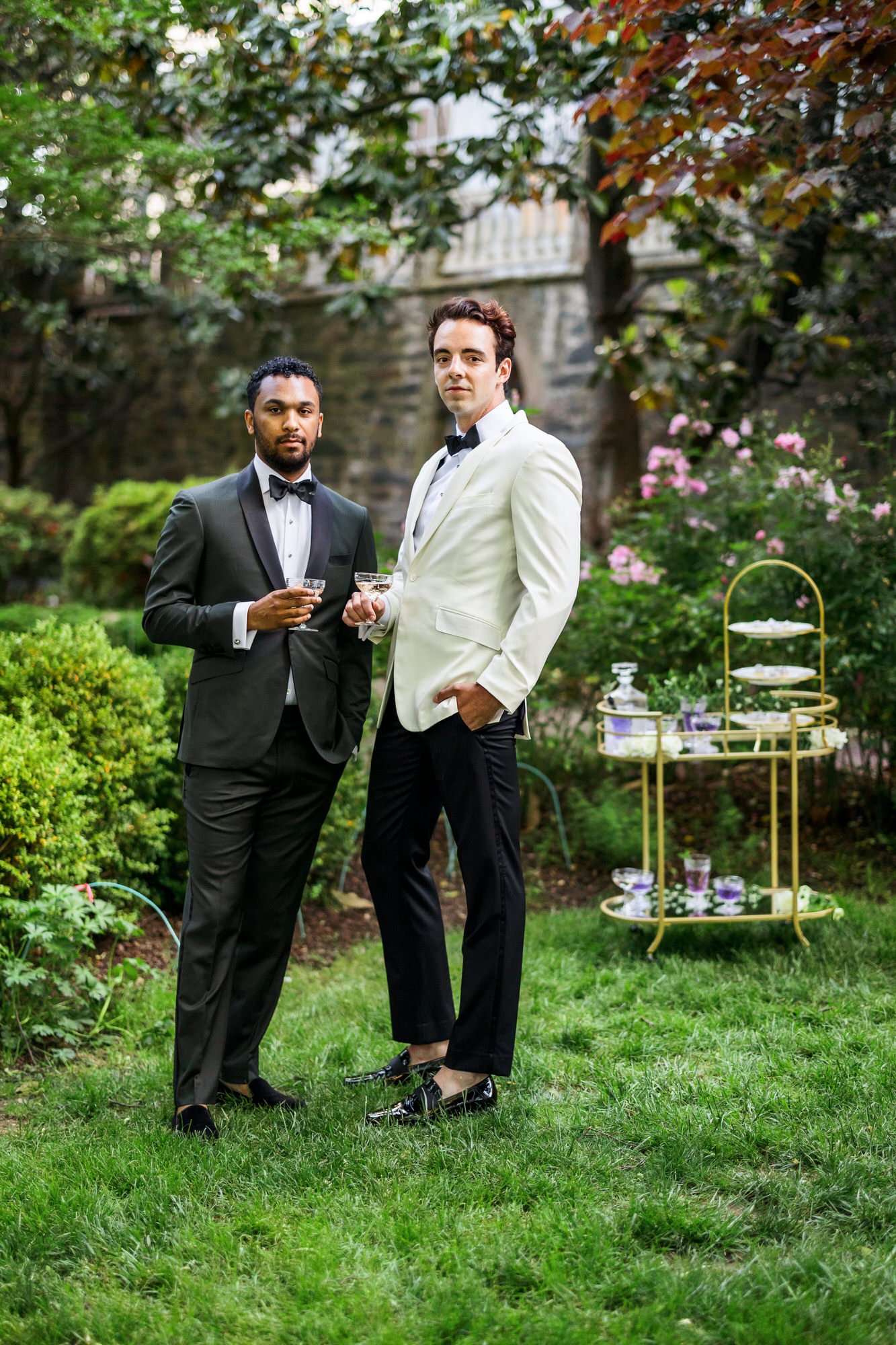 two grooms sipping drinks during bridal portraits