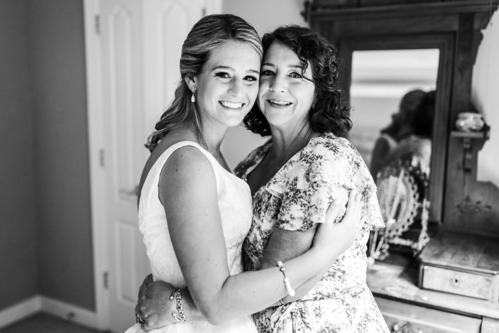 bride hugging mother on wedding day in Charlottesville