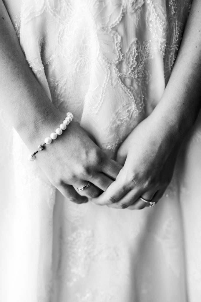 bride holding hands showing details jewelry
