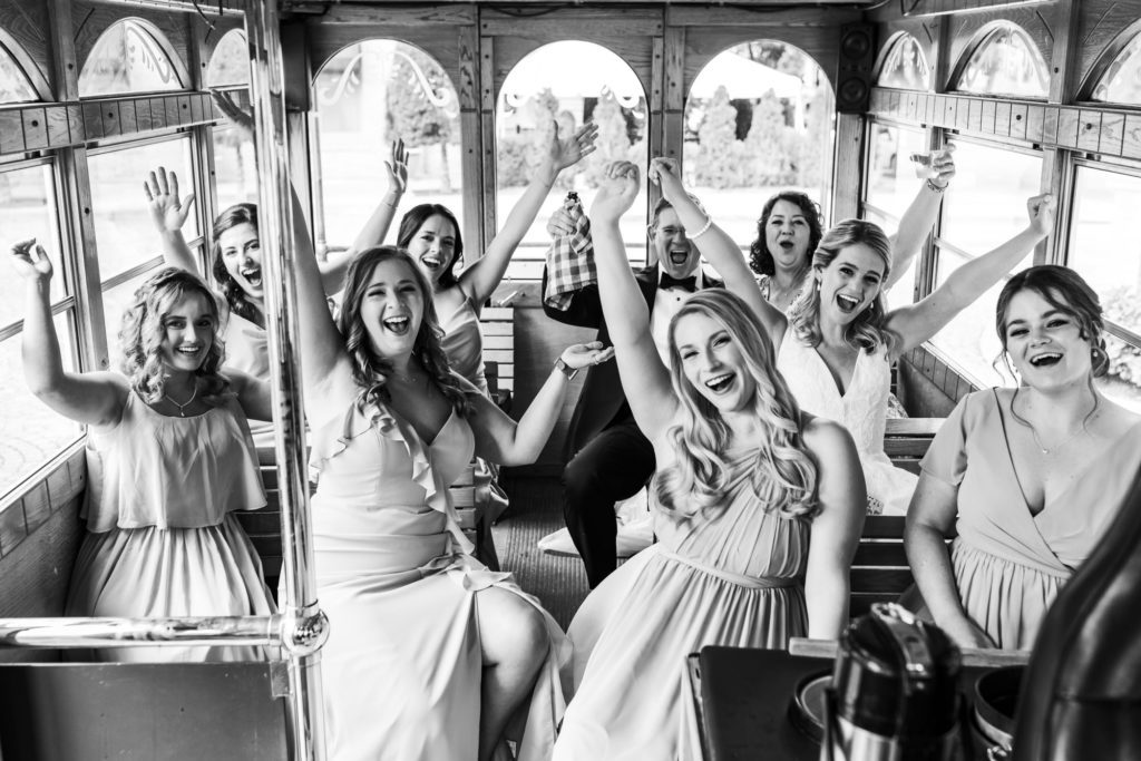 bride celebrating with her bridesmaids on wedding day