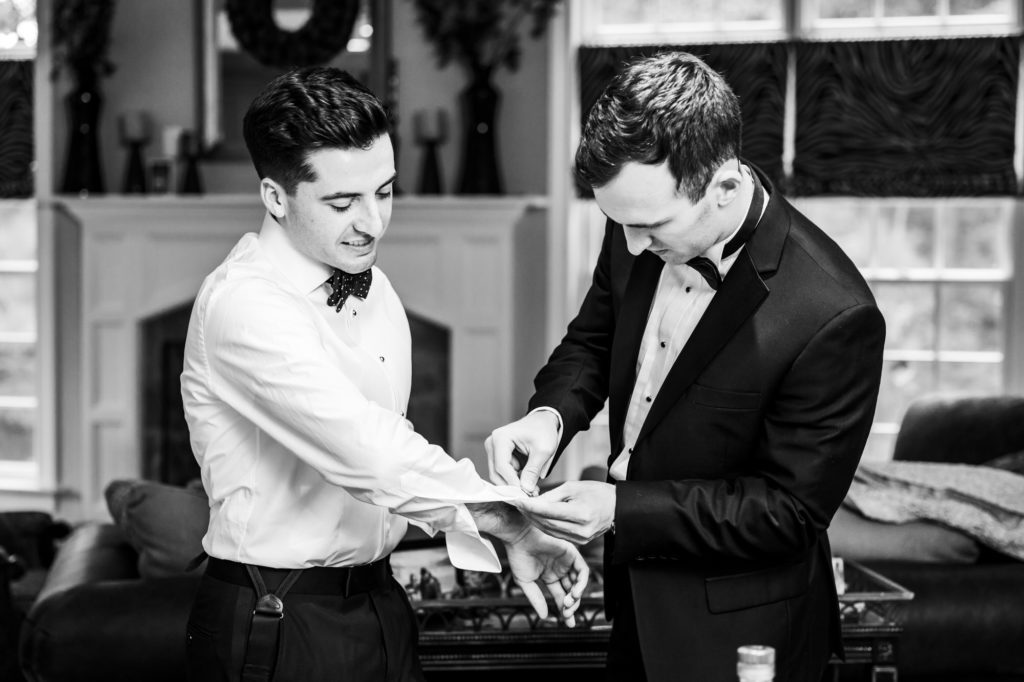 groom getting help with cufflinks on elegent jefferson hotel wedding day