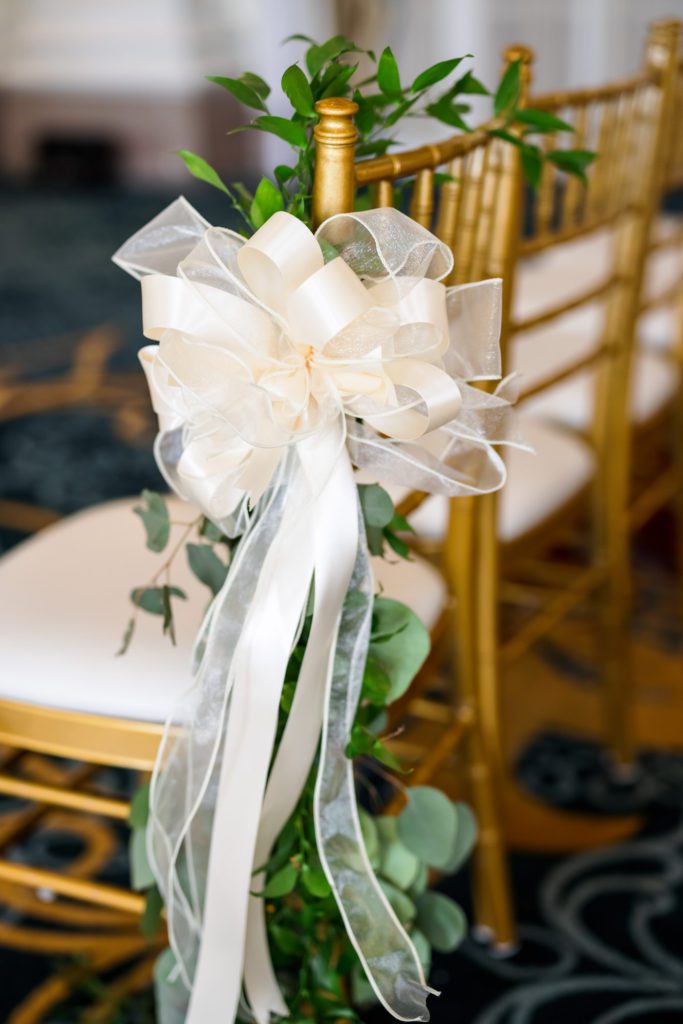 ribbon on chair at wedding ceremony