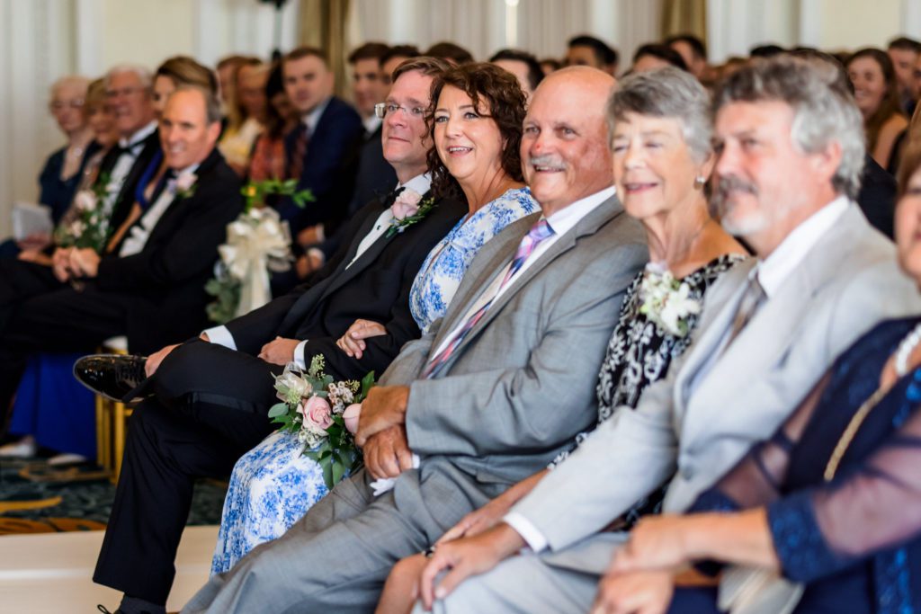 guests smiling during charlottesville wedding ceremony