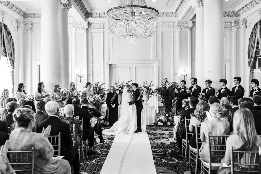 couple shares first kiss as husband and wife at Jefferson Hotel Empire Ball Room Ceremony