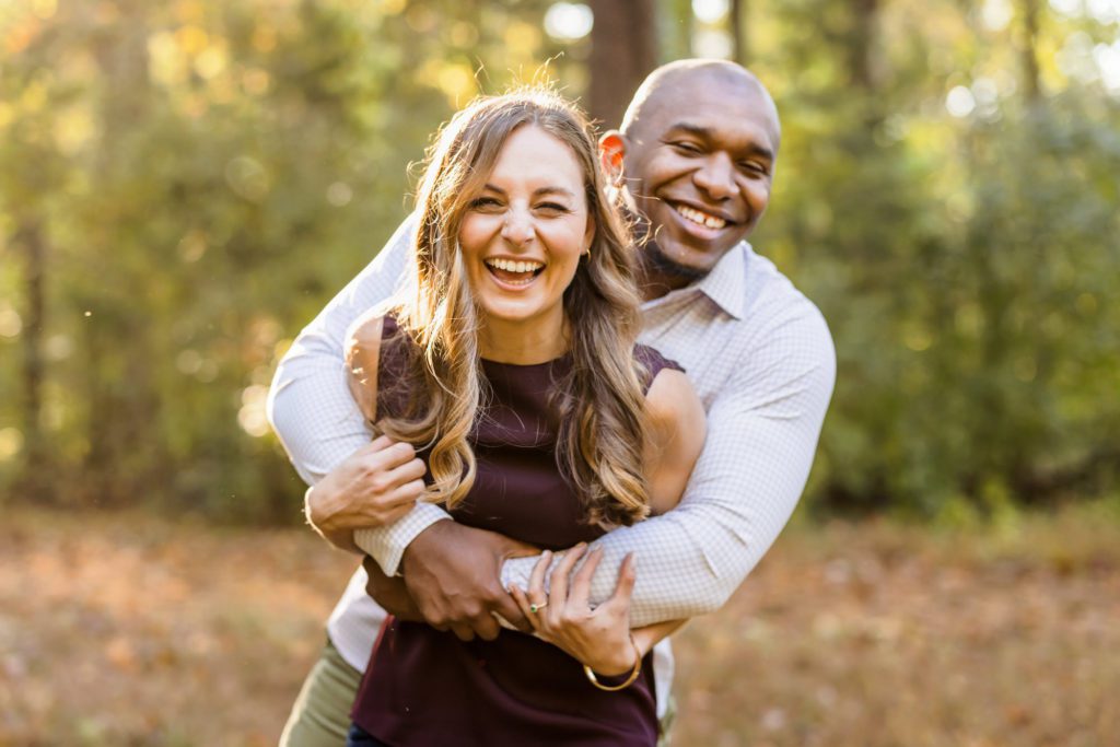 man and woman hugging during fall charlottesville engagement session