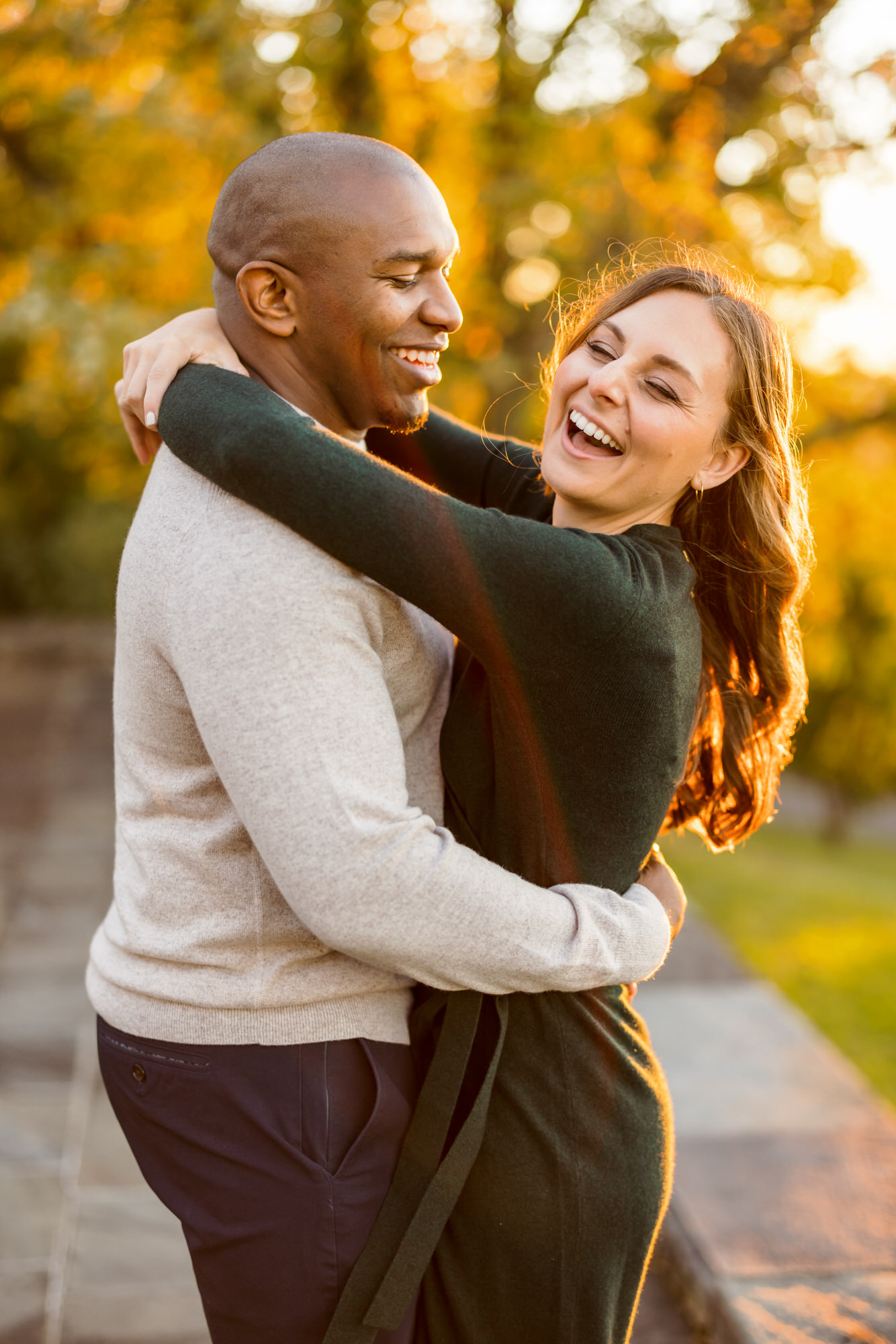man and woman hugging and laughing 