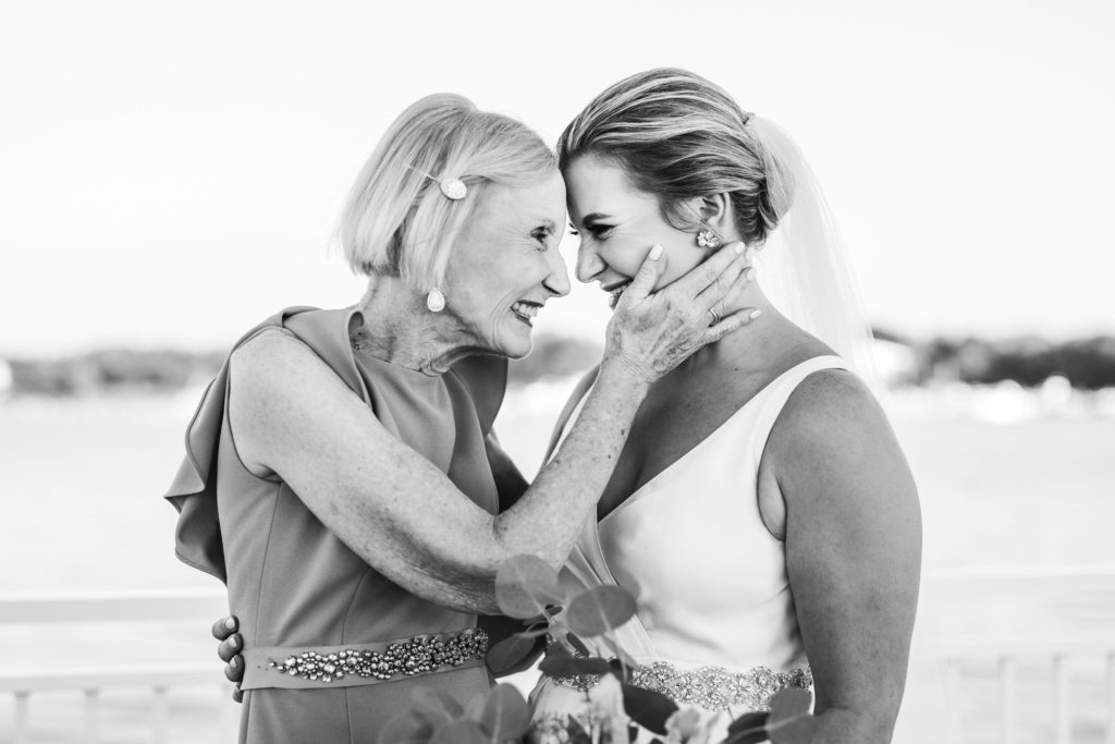 bride and grandma foreheads together 