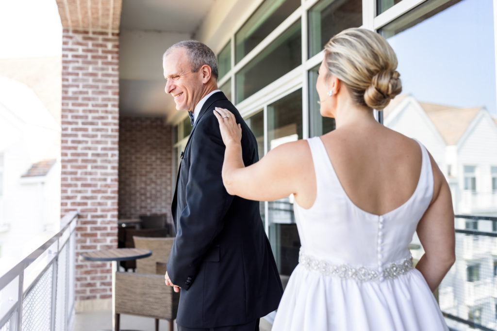 bride walking up to father during first look 