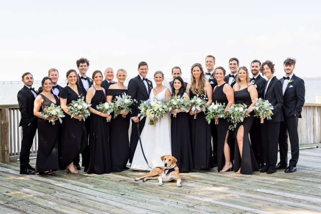 bride and groom posing with wedding party at black tie eastern shore wedding