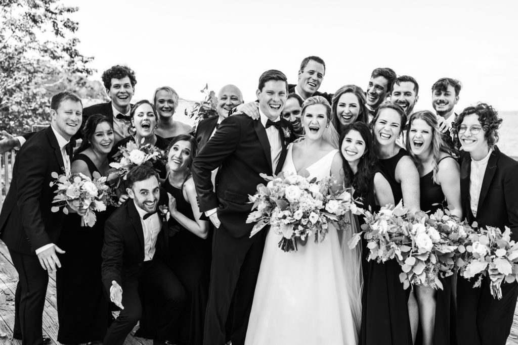 bridal party laughing and celebrating on wedding day